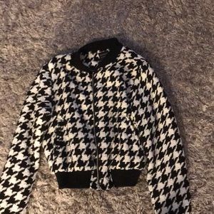 Black and white F21 jacket with a silky inside.
